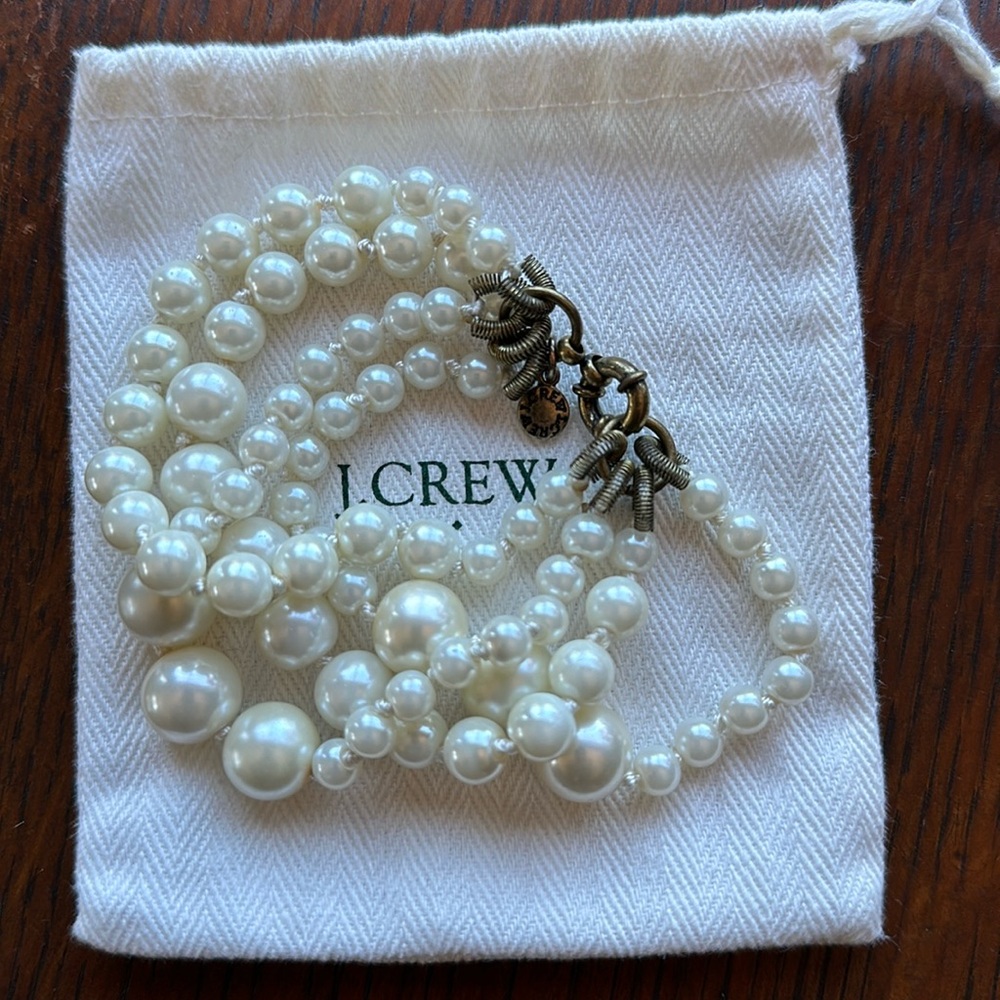 J.Crew multi strand (4) pearl bracelet. Varied pearl size. Gold toned clasp. EUC